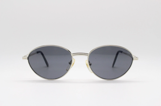 90S Vintage Oval Sunglasses. Chrome Silver Metal Frame With Slender Arm Holes & Dark Lenses. Unused Nos