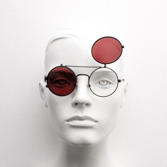 90S Vintage Round Flip Up Sunglasses By Senator. Made in Italy. Black Matt Finish Metal Frame Flipper With Clear & Coral Lens. Unused Nos